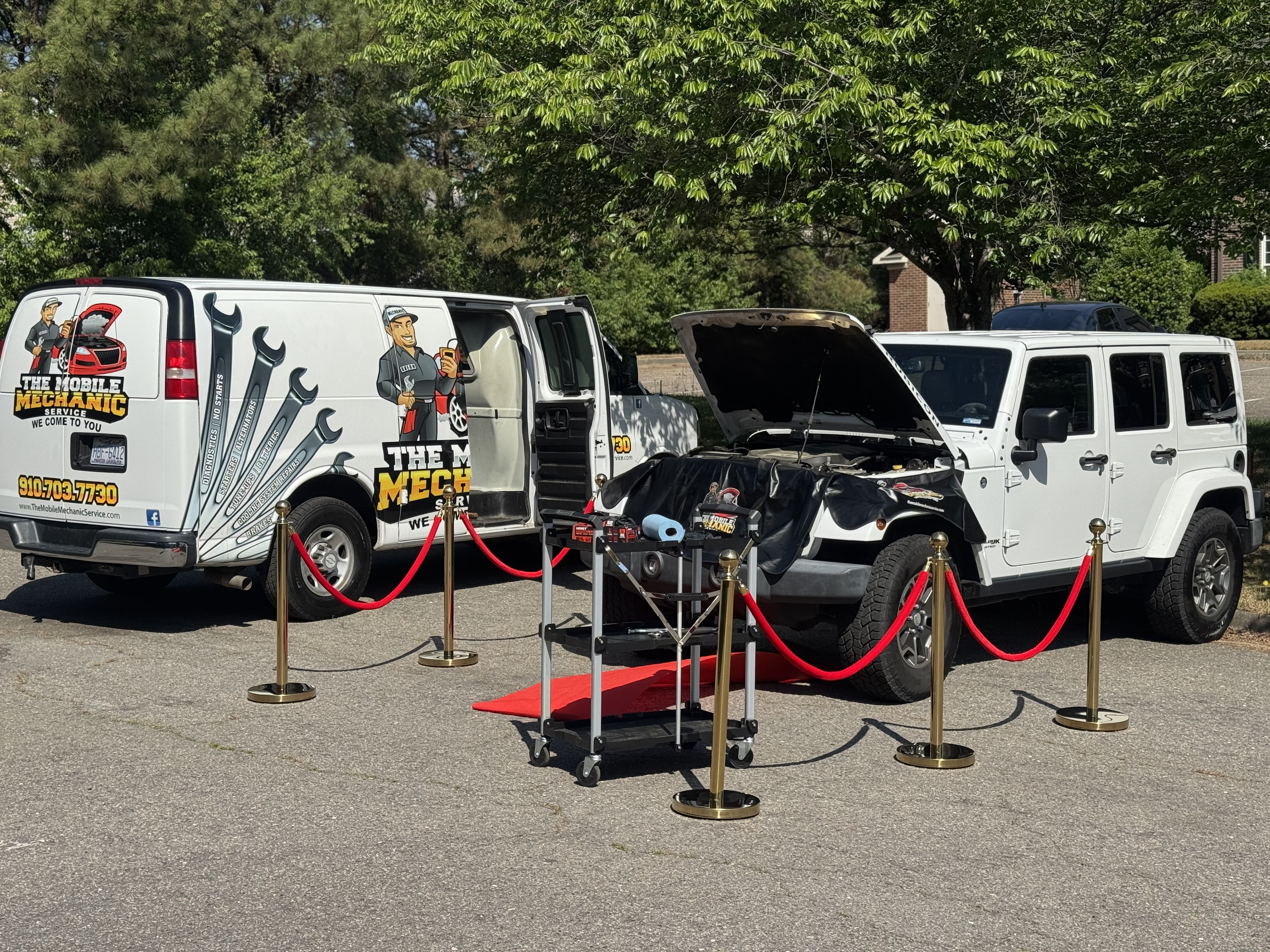 Branded Mobile Mechanic Service vans and a fully equipped service display